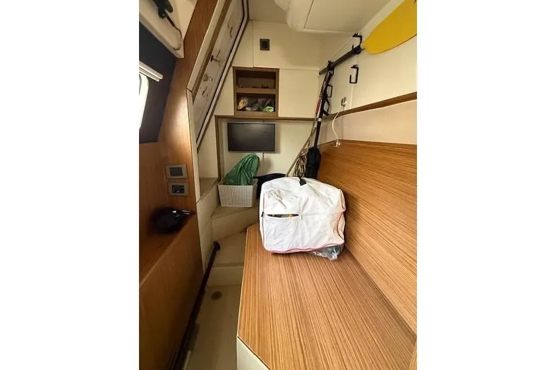 Slide: The Image of Interior cabin of 2018 Absolute Navetta 52 yacht with wooden finish and storage. - 30