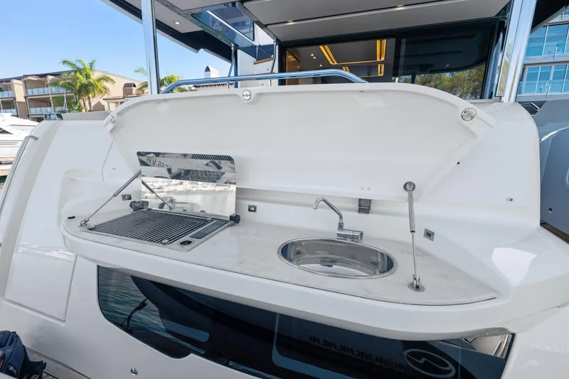 Slide: The Image of Outdoor kitchen on 2018 Absolute Navetta 52 yacht with grill and sink. - 41