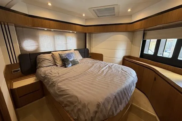 Slide: The Image of Luxurious bedroom interior of 2018 Absolute Navetta 52 yacht with elegant wood finishes. - 8