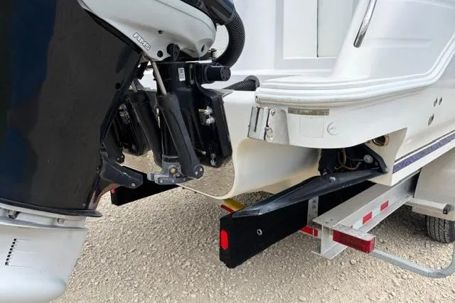 Slide: The Image of 2007 Donzi 38 ZF Open boat on trailer, showing engine and hull details. - 10