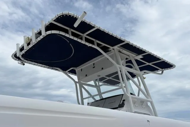 Slide: The Image of 2007 Donzi 38 ZF Open boat with blue canopy against cloudy sky. - 16