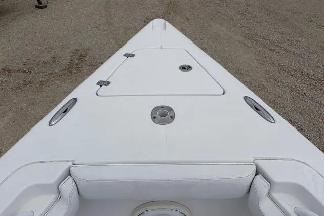 Slide: The Image of 2007 Donzi 38 ZF Open boat deck, featuring sleek white design and storage compartments. - 18