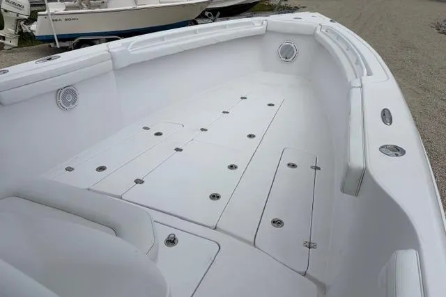 Slide: The Image of 2007 Donzi 38 ZF Open boat interior with spacious deck and storage compartments. - 20