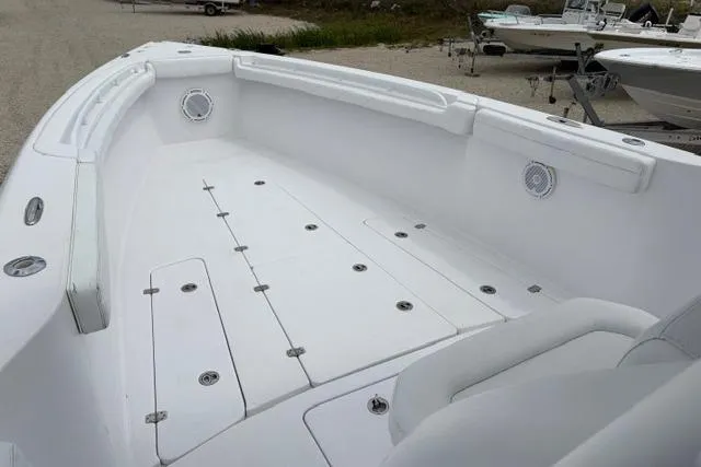 Slide: The Image of 2007 Donzi 38 ZF Open boat interior, featuring spacious white deck and seating area. - 21