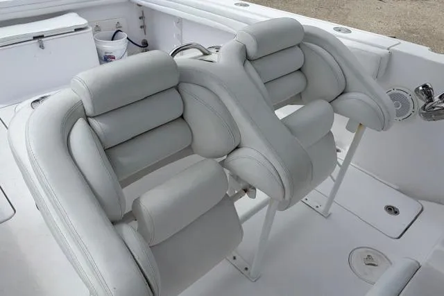 Slide: The Image of 2007 Donzi 38 ZF Open boat interior with cushioned seating and white upholstery. - 23