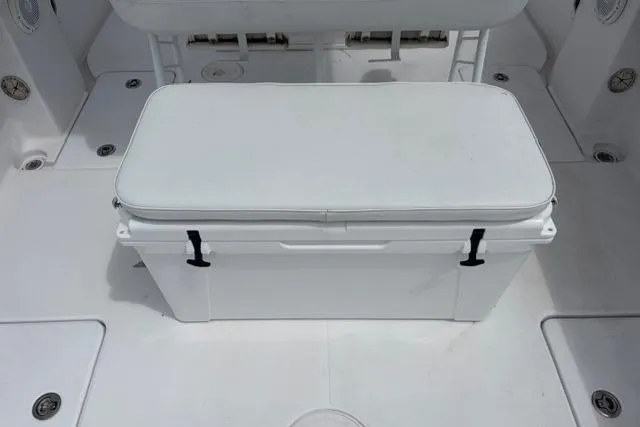 Slide: The Image of White cooler on 2007 Donzi 38 ZF Open boat deck, featuring clean design and secure latches. - 25