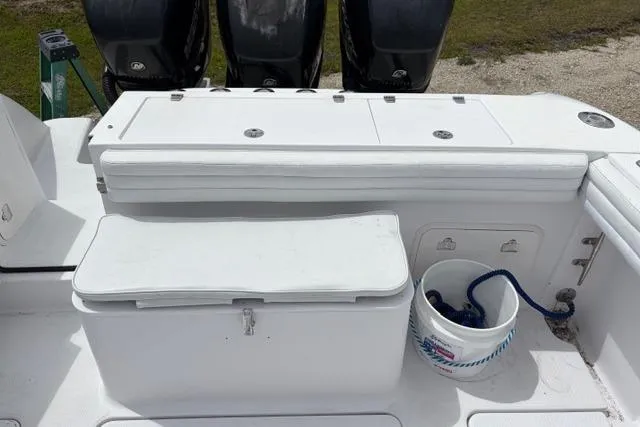 Slide: The Image of 2007 Donzi 38 ZF Open boat deck with storage compartments and engines. - 26