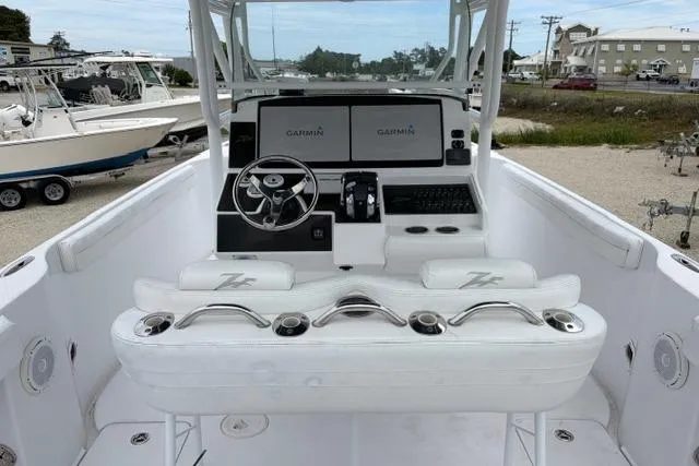 Slide: The Image of 2007 Donzi 38 ZF Open boat cockpit with Garmin navigation system and sleek white seating. - 28