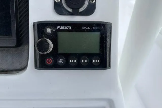 Slide: The Image of Fusion MS-NRX300 marine stereo control on 2007 Donzi 38 ZF Open boat dashboard. - 30
