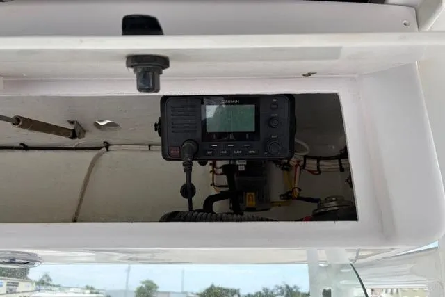 Slide: The Image of Garmin marine radio installed on a 2007 Donzi 38 ZF Open boat dashboard. - 33