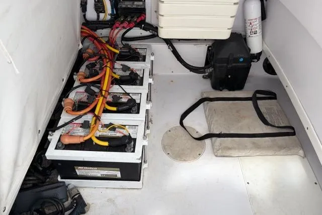 Slide: The Image of Battery compartment of a 2007 Donzi 38 ZF Open boat with wiring and safety equipment. - 34