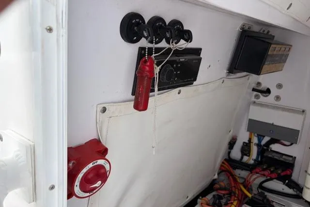 Slide: The Image of 2007 Donzi 38 ZF Open boat interior with control panel and wiring. - 35