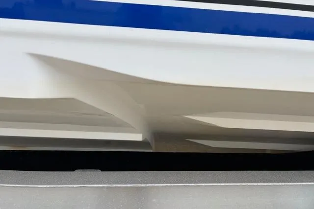 Slide: The Image of Close-up of a 2007 Donzi 38 ZF Open boat hull with blue stripe detailing. - 7