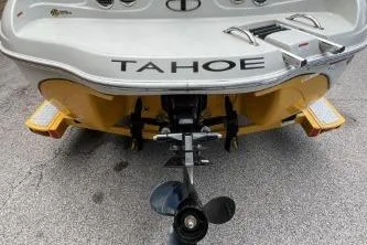 Slide: The Image of Rear view of a 2013 Tahoe Q4 SF boat with visible propeller and branding. - 11