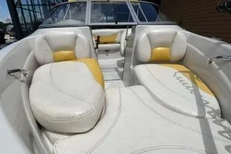 Slide: The Image of 2013 Tahoe Q4 SF boat interior with white and yellow seating. - 9