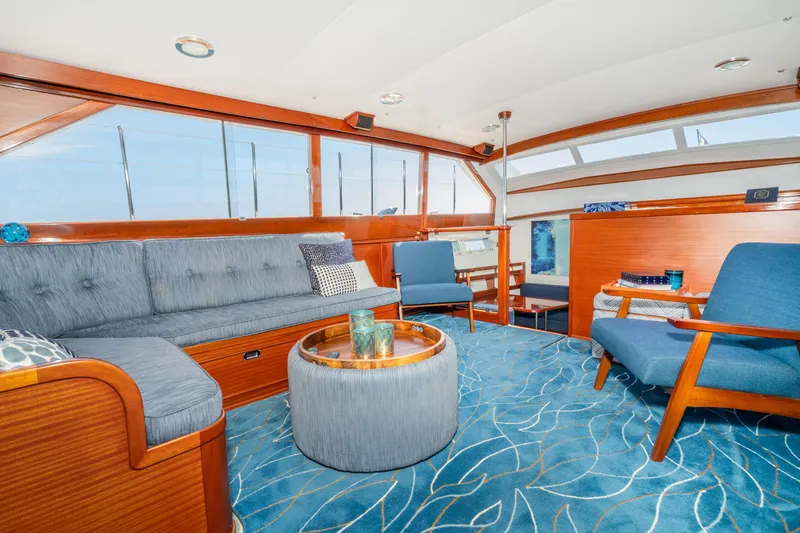 Slide: The Image of Luxurious interior of 1965 Chris-Craft 57 Constellation yacht with elegant seating and blue accents. - 24