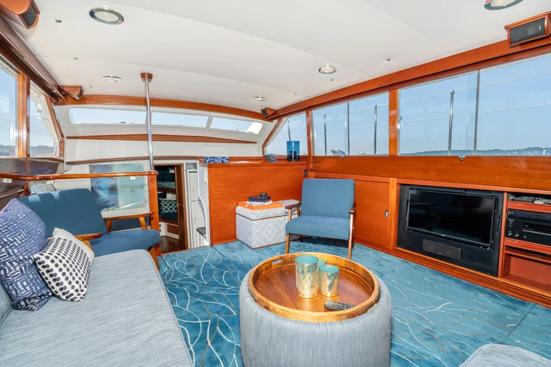 Slide: The Image of Luxurious interior of a 1965 Chris-Craft 57 Constellation yacht with elegant wood finishes. - 25