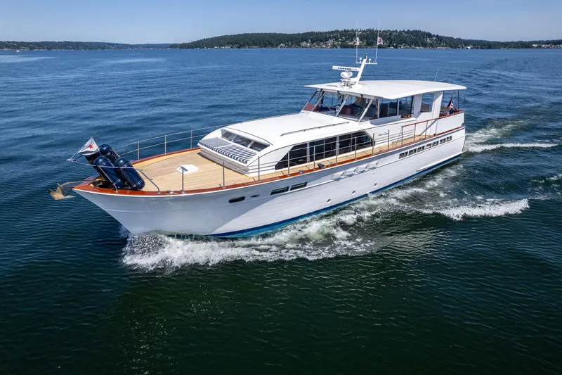 Slide: The Image of 1965 Chris-Craft 57 Constellation yacht cruising on open water. - 4