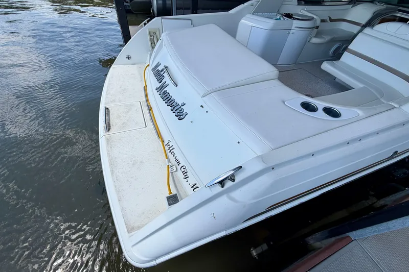 Slide: The Image of 2003 Formula 330 Sun Sport boat docked, featuring spacious seating and sleek design. - 13
