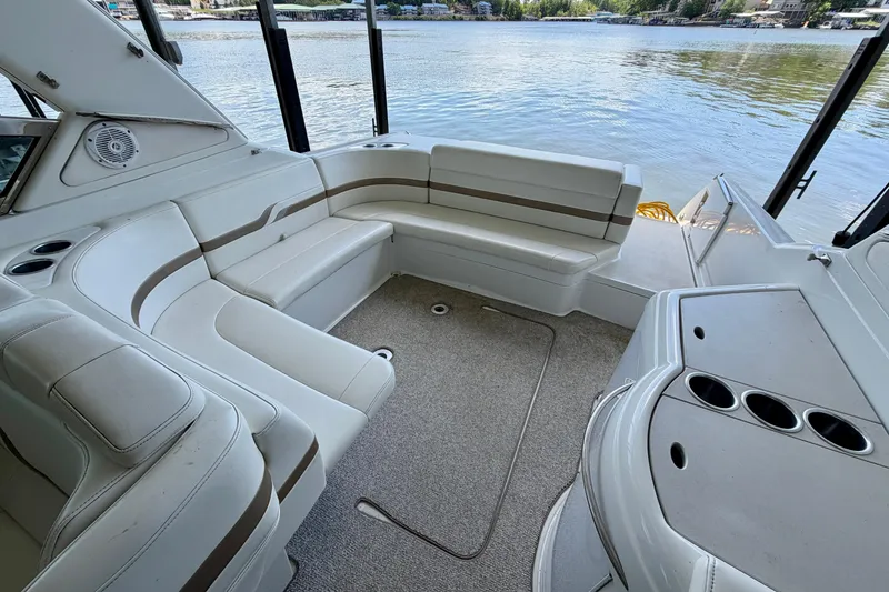 Slide: The Image of Luxurious interior of 2003 Formula 330 Sun Sport boat with comfortable seating and lake view. - 16