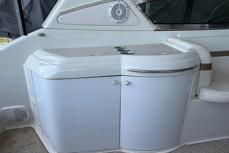 Slide: The Image of Interior view of a 2003 Formula 330 Sun Sport boat, featuring a sleek white cabinet. - 18