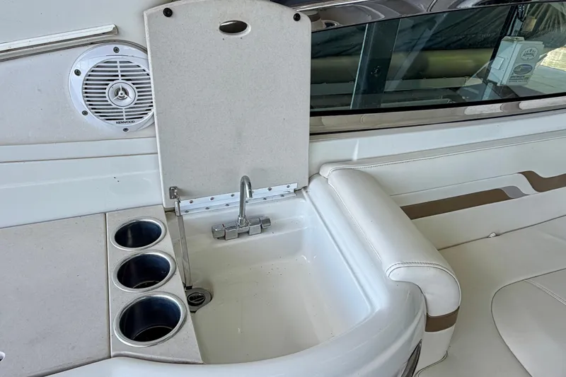 Slide: The Image of 2003 Formula 330 Sun Sport boat interior with sink and cup holders. - 19