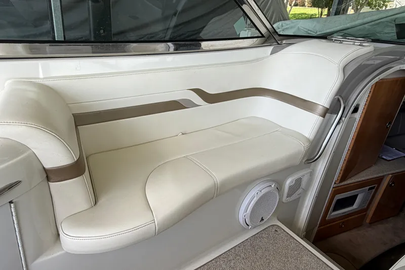 Slide: The Image of 2003 Formula 330 Sun Sport boat interior with white seating and speaker. - 20