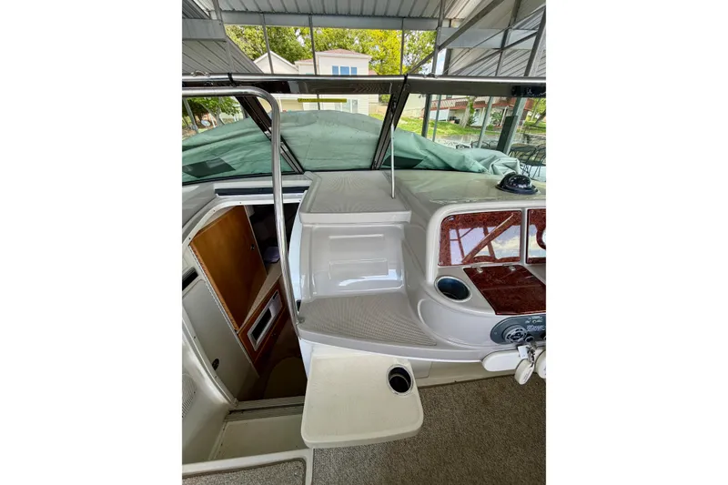 Slide: The Image of 2003 Formula 330 Sun Sport boat interior with helm and cabin entrance. - 25
