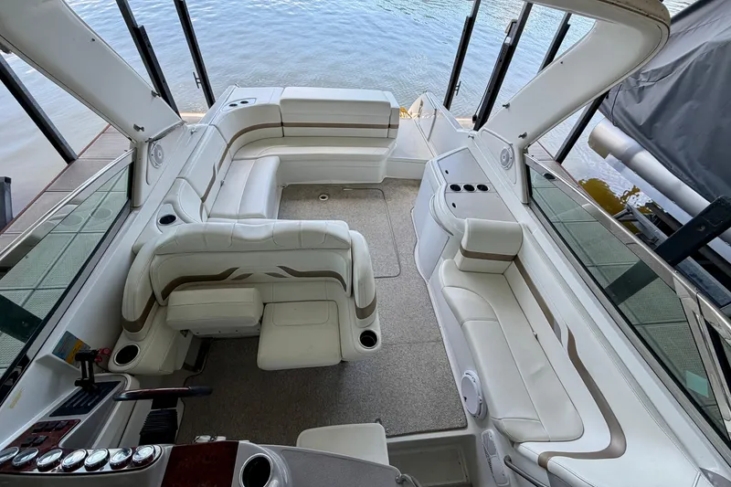 Slide: The Image of 2003 Formula 330 Sun Sport boat interior with white seating and open deck layout. - 26
