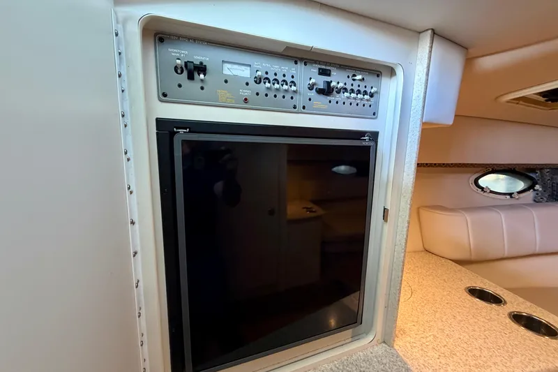 Slide: The Image of Interior of 2003 Formula 330 Sun Sport boat with control panel and seating area. - 33