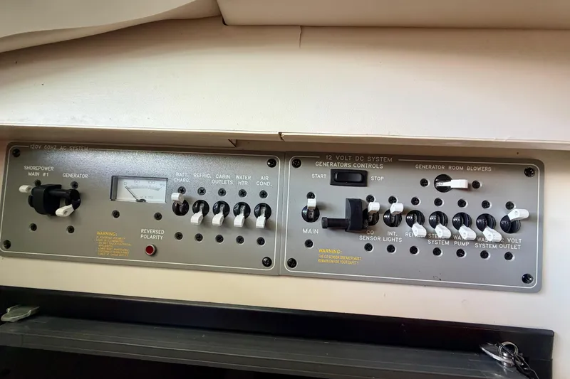 Slide: The Image of Control panel of a 2003 Formula 330 Sun Sport boat, featuring various switches and indicators. - 34