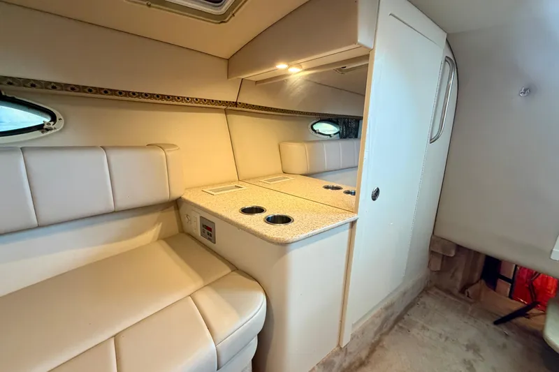 Slide: The Image of Interior of 2003 Formula 330 Sun Sport boat with beige seating and compact kitchenette. - 36