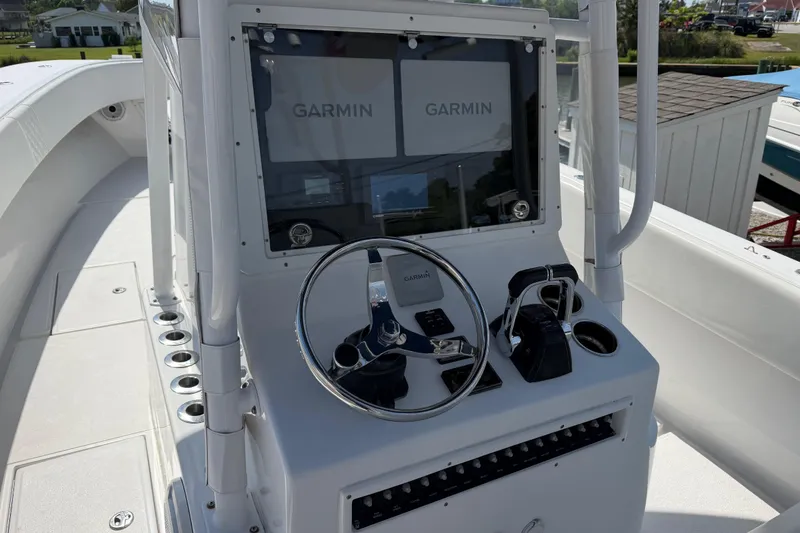 Slide: The Image of Center console of a 2021 Competition 31 boat with Garmin navigation displays. - 14