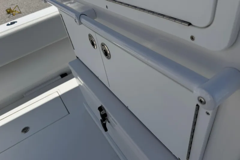 Slide: The Image of Interior view of a 2021 Competition 31 boat, featuring storage compartments. - 17