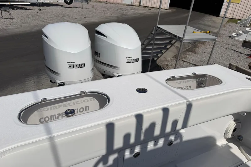 Slide: The Image of Twin Yamaha 300 engines on a 2021 Competition 31 boat, dockside view. - 20