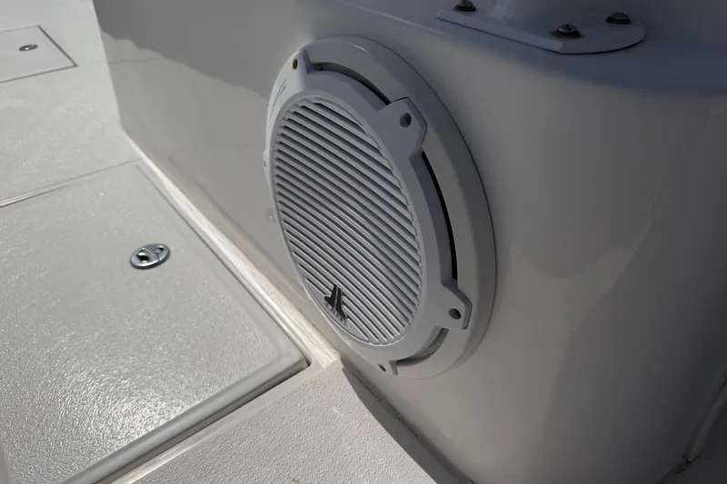 Slide: The Image of White speaker on a 2021 Competition 31 boat deck. - 22