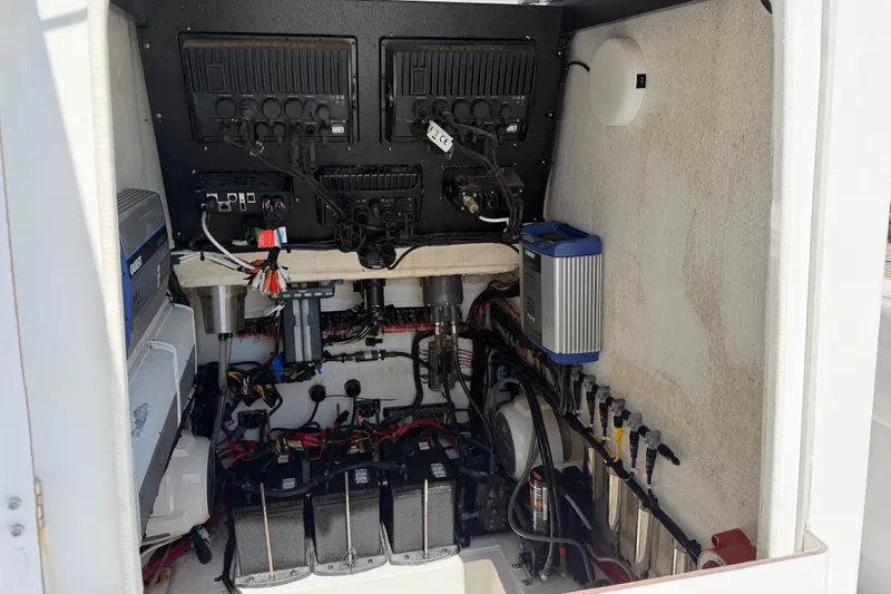 Slide: The Image of Electrical system setup in a 2021 Competition 31 boat, featuring organized wiring and components. - 26