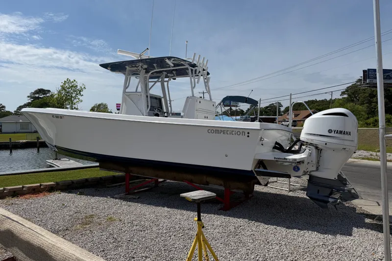 Slide: The Image of 2021 Competition 31 boat with Yamaha engine on display outdoors. - 5