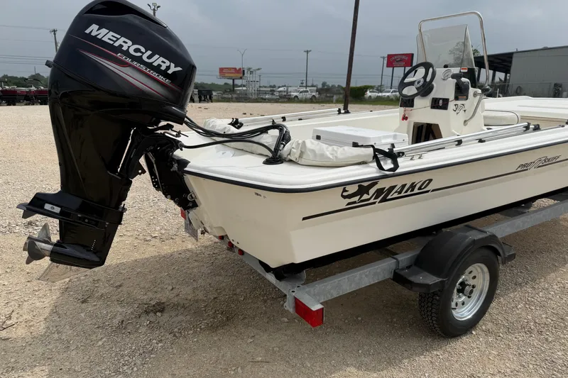 Slide: The Image of 2015 Mako Pro Skiff 17 CC boat with Mercury outboard motor on trailer. - 3