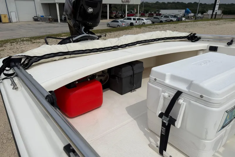 Slide: The Image of 2015 Mako Pro Skiff 17 CC boat interior with cooler and fuel tank. - 6