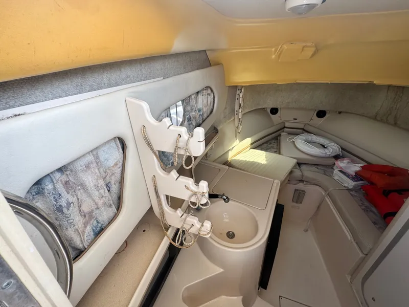 Slide: The Image of Interior of 2002 Grady-White Sailfish 282 with sink and seating area. - 11