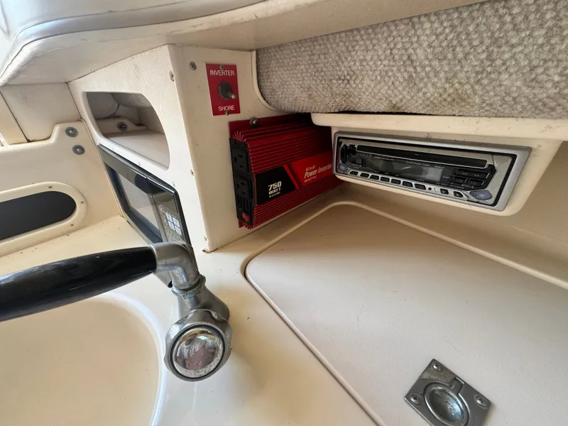 Slide: The Image of Interior of a 2002 Grady-White Sailfish 282 boat with controls and electronics. - 13