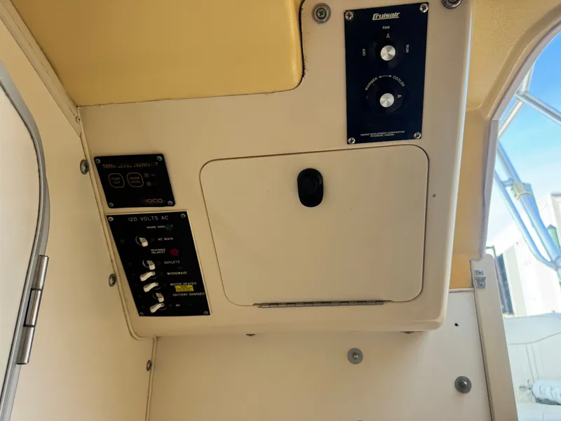 Slide: The Image of Interior view of 2002 Grady-White Sailfish 282 boat control panel. - 14