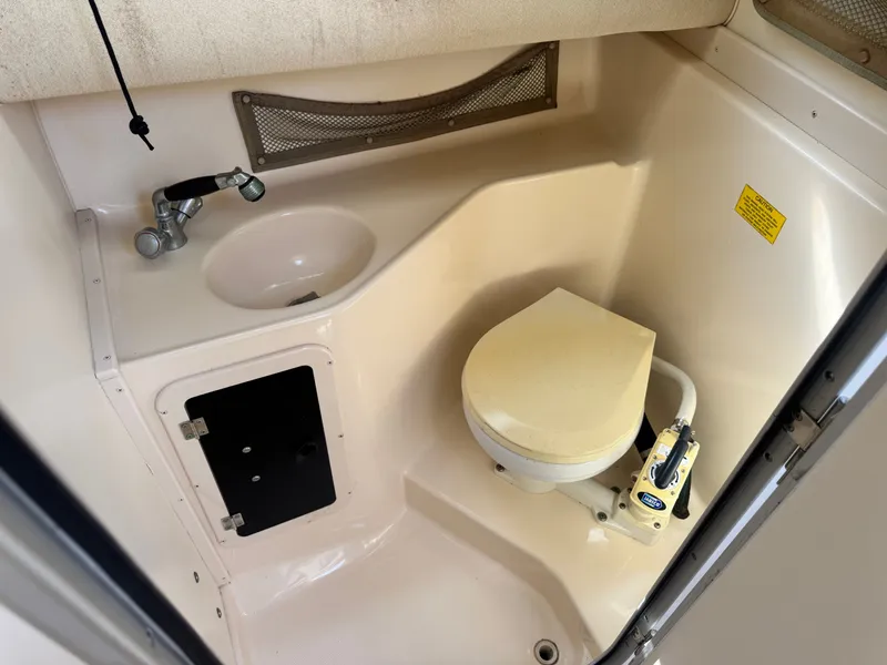 Slide: The Image of Interior of 2002 Grady-White Sailfish 282 with toilet and sink. - 15