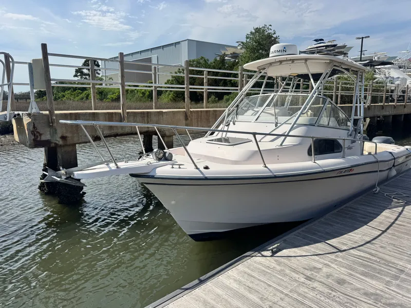 Slide: The Image of 2002 Grady-White Sailfish 282 boat docked at marina. - 2