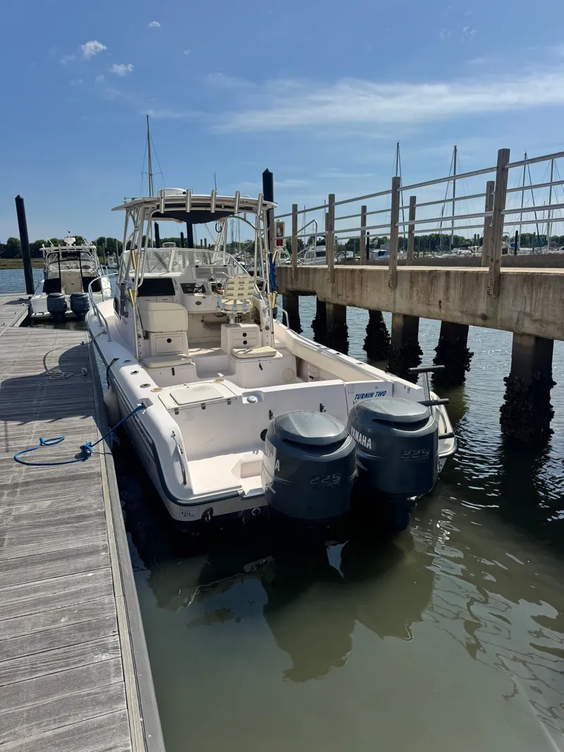 Slide: The Image of 2002 Grady-White Sailfish 282 boat docked with twin Yamaha engines. - 3