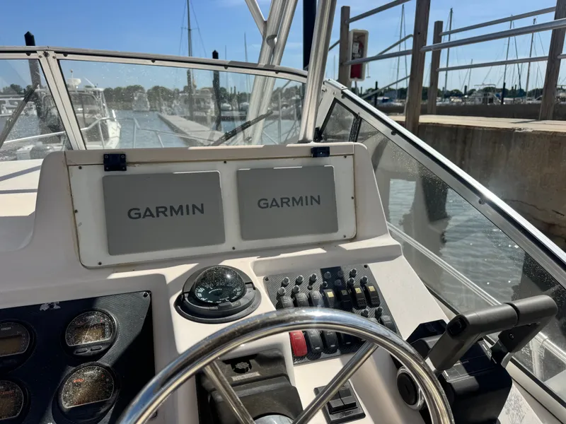 Slide: The Image of 2002 Grady-White Sailfish 282 helm with Garmin displays. - 8