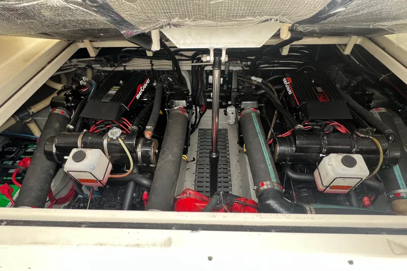 Slide: The Image of Engine compartment of a 1993 Tiara Yachts 3100 Open, featuring dual MerCruiser engines. - 26