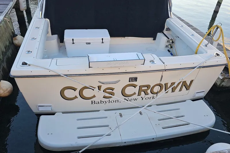 Slide: The Image of 1993 Tiara Yachts 3100 Open docked, featuring "CC's Crown" from Babylon, New York. - 32