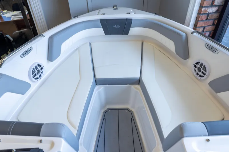 Slide: The Image of Interior view of 2025 Chaparral 21 SSi OB boat, featuring sleek seating and modern design. - 10